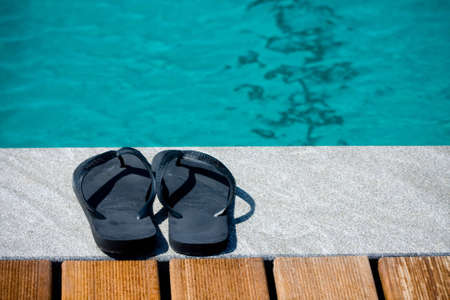 Relaxing by the swimming pool during summer vacation or holidaysの写真素材