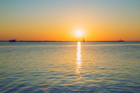 Latvia, Riga, Baltic sea, sunset, mole and wave, yacht. 2017のeditorial素材