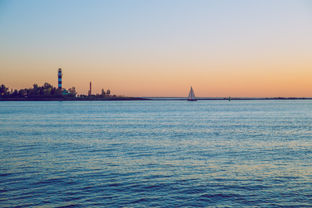 Latvia, Riga, Baltic sea, sunset, mole and wave, yacht. 2017のeditorial素材