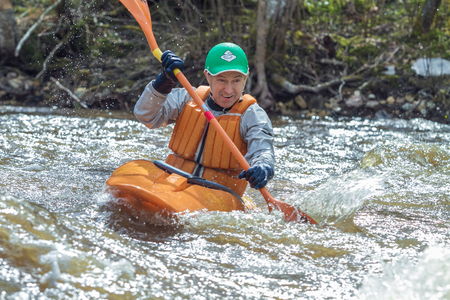 Rafting race in spring. River amata, Latvia. Peoples and boat, water and speed. 2012.のeditorial素材