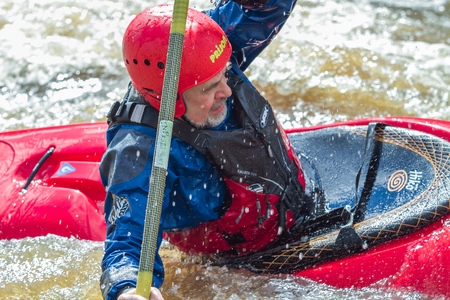Rafting race in spring. River amata, Latvia. Peoples and boat, water and speed. 2012.のeditorial素材