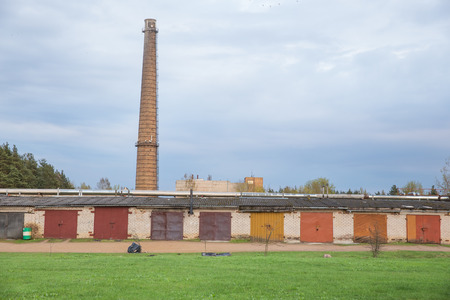 City Jekabpils, Latvia. Old factory tower and garages, urban city view.の写真素材