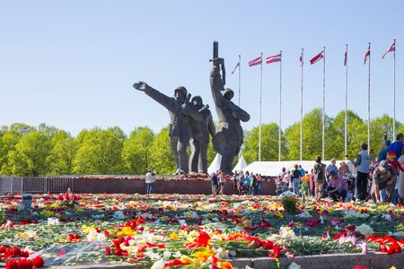 Latvia, city Riga, Victory park, May 9, celebration 73 year after world war 2, peoples, flowers and sun. Travel photo 2018のeditorial素材