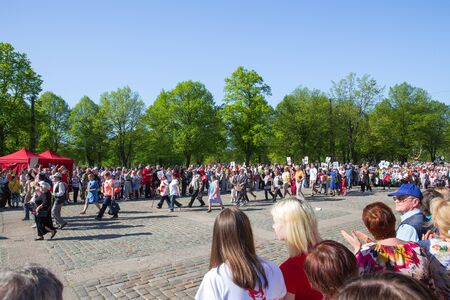 Latvia, city Riga, Victory park, May 9, celebration 73 year after world war 2, peoples, flowers and sun. Travel photo 2018のeditorial素材