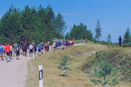 City Ikskile, Latvia. Daring race, sport event. Outdoor training, people are running. Sunny day. 2018 Travel photo.のeditorial素材