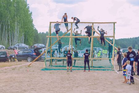 City Ikskile, Latvia. Daring race, sport event. Outdoor training, people are running. Sunny day....