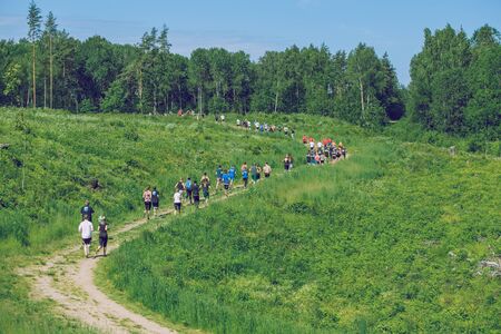 City Ikskile, Latvia. Daring race, sport event. Outdoor training, people are running. Sunny day....