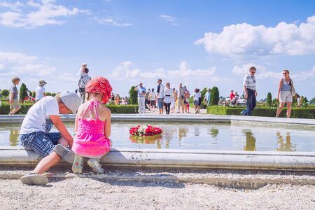 City Rundale, Latvia. Children play at park and people walk. Flower garden at Castle. 2010のeditorial素材