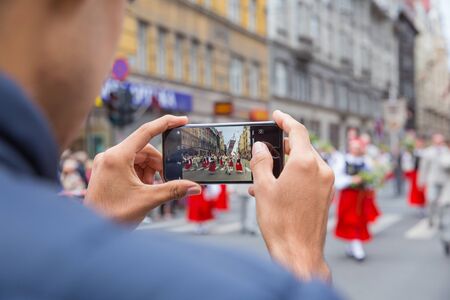 City Riga, Latvia. Choral Festival, singers at street, national costume and culture. Travel photo 2018.のeditorial素材