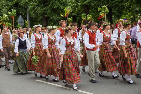 City Riga, Latvia. Choral Festival, singers at street, national costume and culture. Travel photo...
