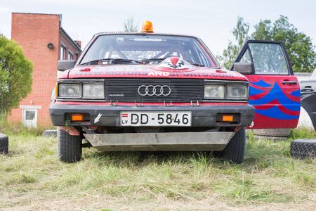 City Livi, Latvia. Amateur rally, dirt road, car with rider. Speed and dust. Travel photo 2018のeditorial素材