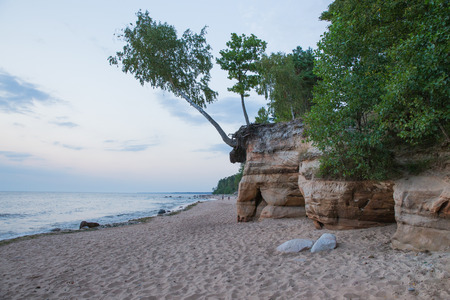 City Veczemju rocks, Latvia. Baltic sea with waves, rocks and blue sky. Summer evening. Travel photo 2018.の写真素材