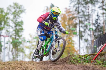 City Cesis, Latvia. Downhill rider with bicycle. Fast speed and jump. Autumn 2018. Travel photo.のeditorial素材