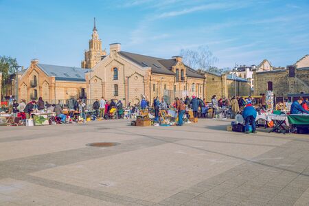 City Riga, Latvia. Flea market at street, peoples sale flea, urban street. Travel photo 2018.