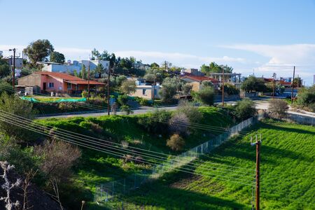 City Paphos, Cyprus. Village and nature. Houses and roofs.  Green shrubs. Travel photo 2018,...