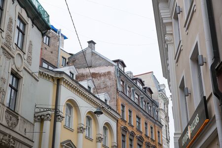 City Riga, Latvia. Old city streets, tourists and architecture. Old houses, streets and urban view. Travel photo 2019. january.Winter, snow and cold.のeditorial素材
