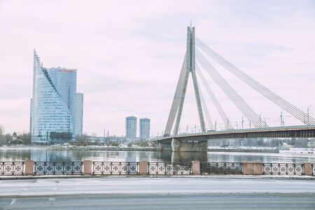 City Riga, Latvia. Old city streets, tourists and architecture. Old bridge, streets and urban view. Travel photo 2019. february.Winter, snow and cold.のeditorial素材