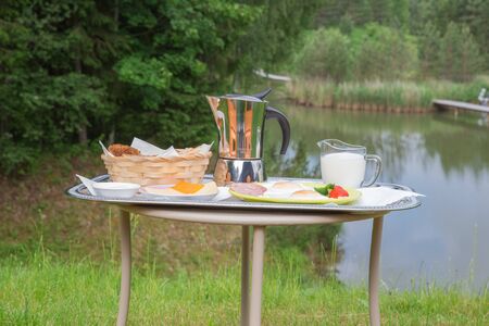 City Amatciems, Latvian republic. Morning breakfast outside. Fried egg, cheese and bread. Travel photo 14. Jun. 2019の写真素材