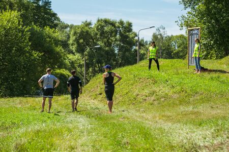 City Cesis, Latvian Republic. Run race, people were engaged in sports activities. Overcoming various obstacles and running.  July 21. 2019.のeditorial素材
