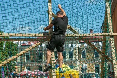 City Cesis, Latvian Republic. Run race, people were engaged in sports activities. Overcoming various obstacles and running.  July 21. 2019.のeditorial素材
