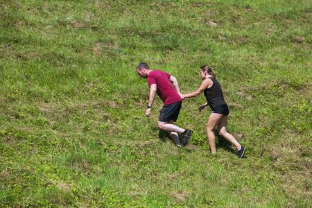 City Cesis, Latvian Republic. Run race, people were engaged in sports activities. Overcoming various obstacles and running.  July 21. 2019.のeditorial素材