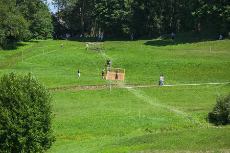 City Cesis, Latvian Republic. Run race, people were engaged in sports activities. Overcoming various obstacles and running.  July 21. 2019.のeditorial素材