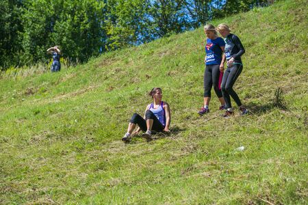 City Cesis, Latvian Republic. Run race, people were engaged in sports activities. Overcoming various obstacles and running.  July 21. 2019.のeditorial素材