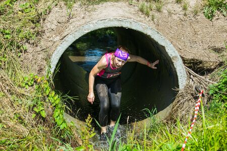 City Cesis, Latvian Republic. Run race, people were engaged in sports activities. Overcoming various obstacles and running.  July 21. 2019.のeditorial素材