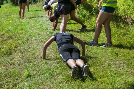 City Cesis, Latvian Republic. Run race, people were engaged in sports activities. Overcoming various obstacles and running.  July 21. 2019.のeditorial素材