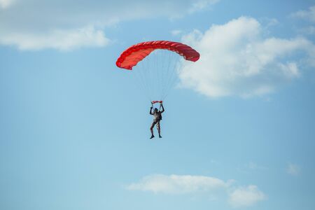 City Riga, Latvian republic. Avio show in honor of the city festival. Parachutists land with parachutes on target. 17 August 2019.のeditorial素材