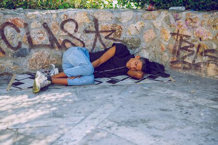City Athens, Greek Republic. Man leep on the street. Urban city  life. 11. Sep. 2019のeditorial素材