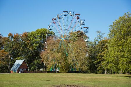 City Sigulda, Latvia Republic. Ferris wheel and trees with yellow leafs. 27. Sep. 2019のeditorial素材