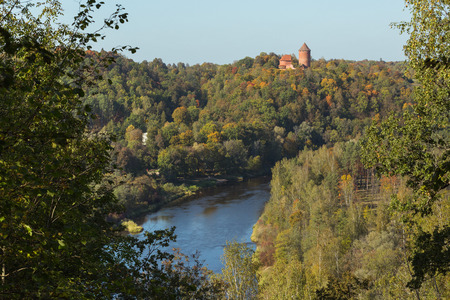 City Sigulda, Latvia Republic. Old castle, build from red bricks. Around trees with yellow leafs. 27. Sep. 2019のeditorial素材