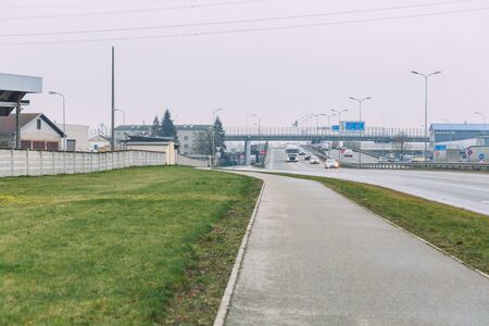 City Riga, Latvia. Street with traffic and ads. Driving cars and visible buildings. City view.15.01.2020のeditorial素材