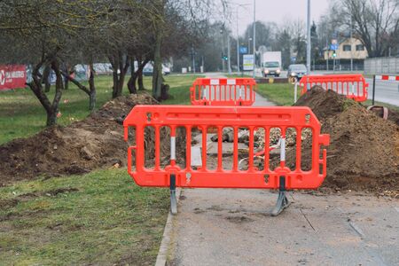 City Riga, Latvia. Fenced street with a hole in front.15.01.2020のeditorial素材