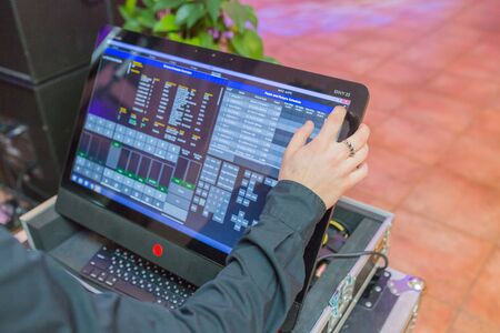 City Cesis, Latvia. Dj arms and monitor with mixer software.14.02.2020