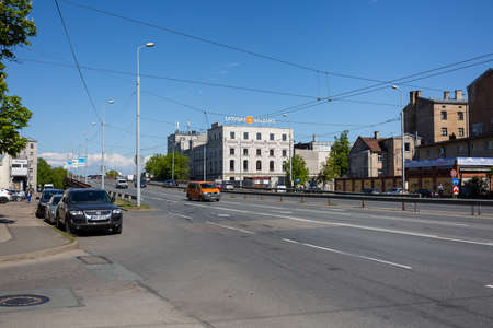 City Riga, Latvia.Latvian balsam factory and old bridge with cars and buildings.29.05.2020のeditorial素材