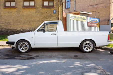 City Cesis, Latvia. Old retro white volkswagen pickup on the street.29.05.2020のeditorial素材