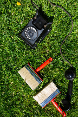 City Cesis, Latvia. Paint brush and old black phone.29.05.2020のeditorial素材