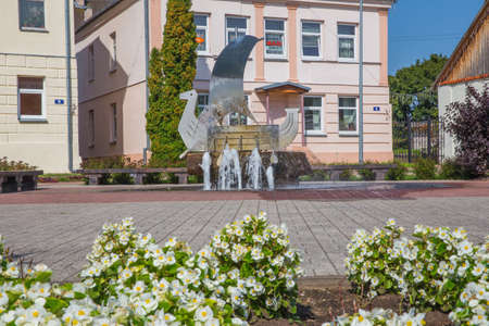City Kraslava, Latvia. Old urban city center. Peoples, street and fountain. Travel photo 2018.のeditorial素材