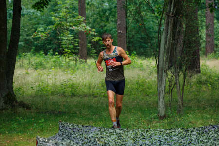 City Riga, Latvia. Run race, people were engaged in sports activities. Overcoming various obstacles and running.  5.07.2020のeditorial素材