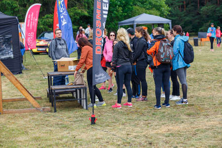 City Riga, Latvia. Run race, people were engaged in sports activities. Overcoming various obstacles and running.  5.07.2020のeditorial素材