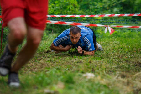 City Riga, Latvia. Run race, people were engaged in sports activities. Overcoming various obstacles and running.  5.07.2020のeditorial素材