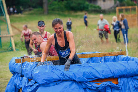 City Riga, Latvia. Run race, people were engaged in sports activities. Overcoming various obstacles and running.  5.07.2020のeditorial素材
