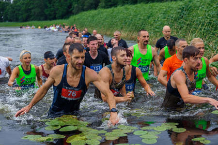 City Riga, Latvia. Run race, people were engaged in sports activities. Overcoming various obstacles and running.  5.07.2020のeditorial素材