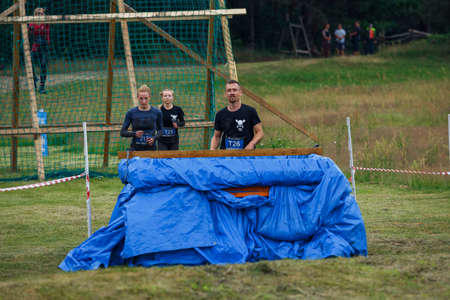 City Riga, Latvia. Run race, people were engaged in sports activities. Overcoming various obstacles and running.  5.07.2020のeditorial素材