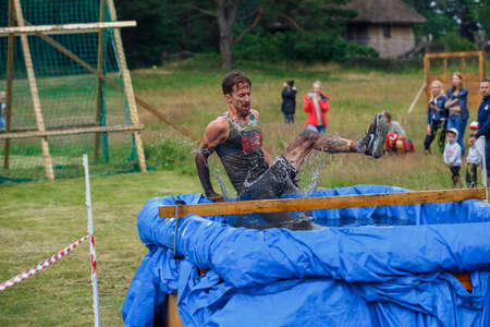 City Riga, Latvia. Run race, people were engaged in sports activities. Overcoming various obstacles and running.  5.07.2020のeditorial素材