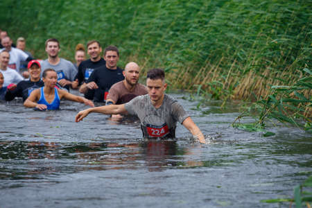 City Riga, Latvia. Run race, people were engaged in sports activities. Overcoming various obstacles and running.  5.07.2020のeditorial素材