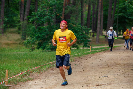 City Riga, Latvia. Run race, people were engaged in sports activities. Overcoming various obstacles and running.  5.07.2020のeditorial素材