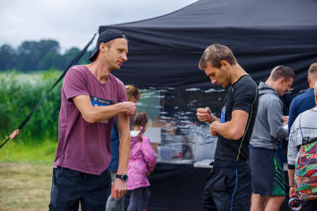 City Riga, Latvia. Run race, people were engaged in sports activities. Overcoming various obstacles and running.  5.07.2020のeditorial素材